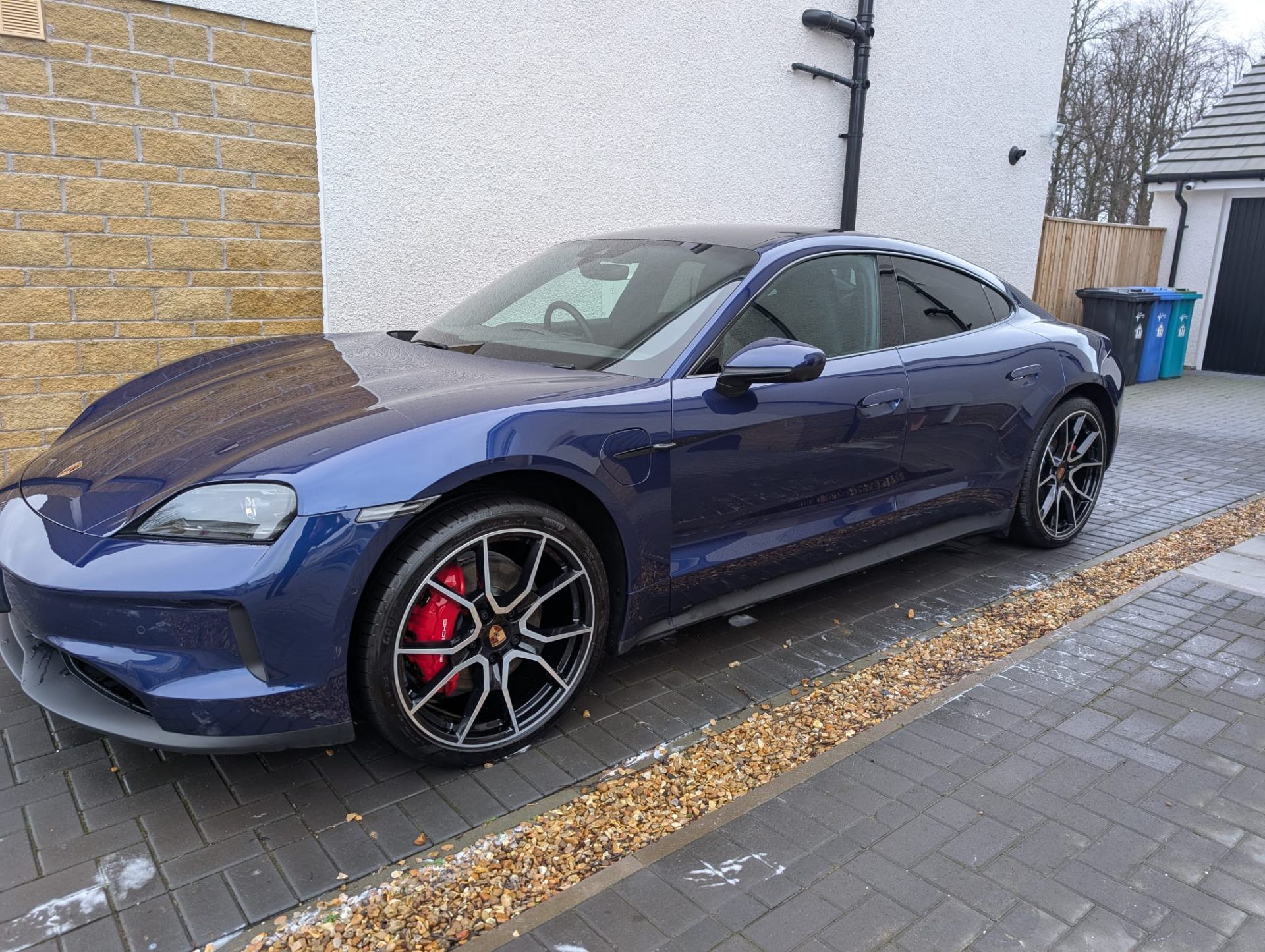 Blue Porsche Taycan front view after gloss enhancement